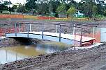 Arched bridge with Cruiserline handrail at installation